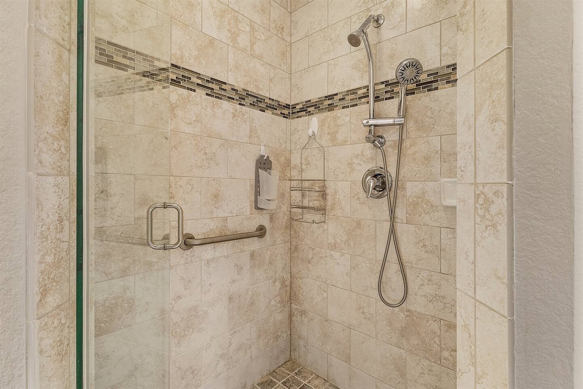 Primary ensuite bathroom featuring a shower.