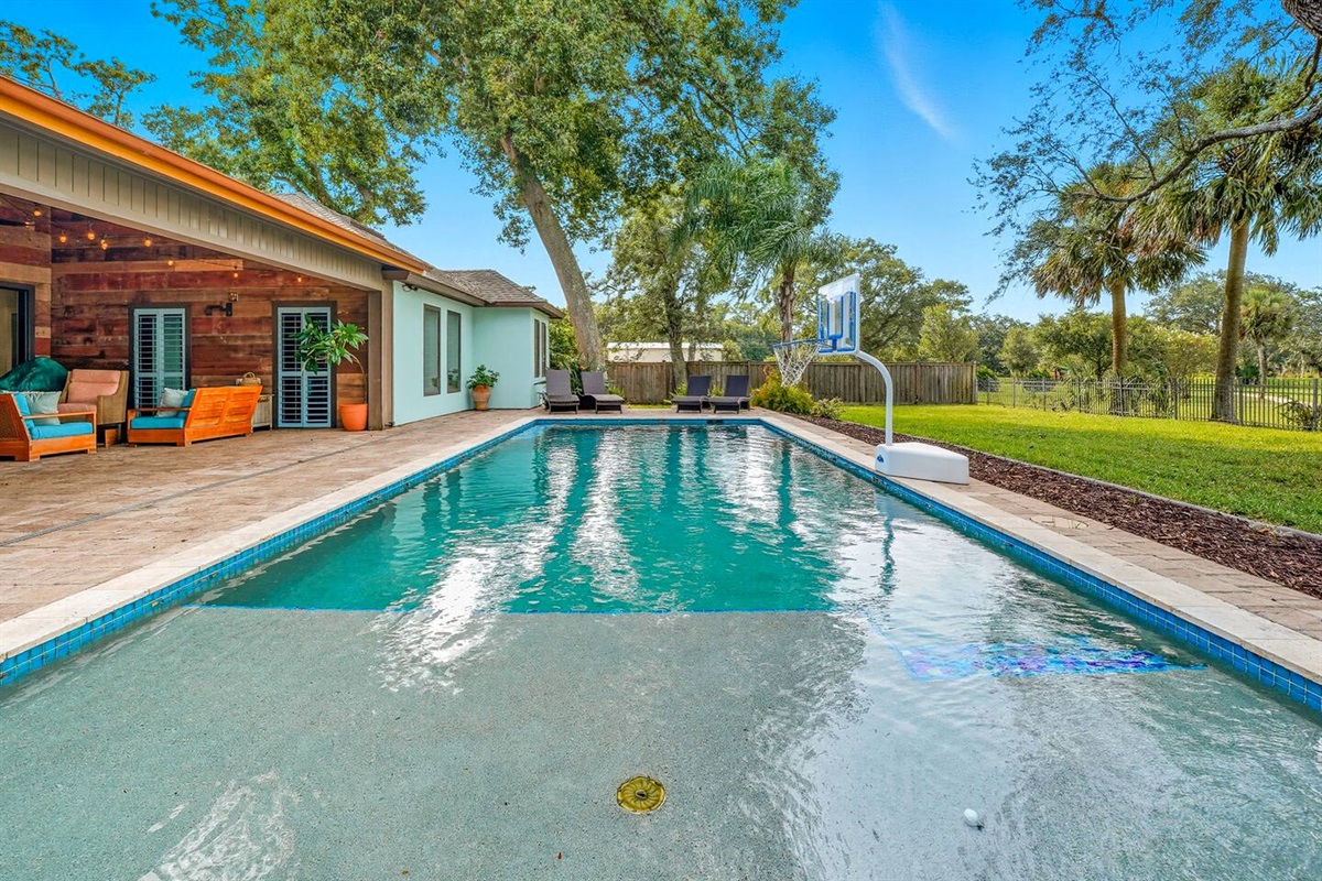 Beautiful heated pool with basketball goal