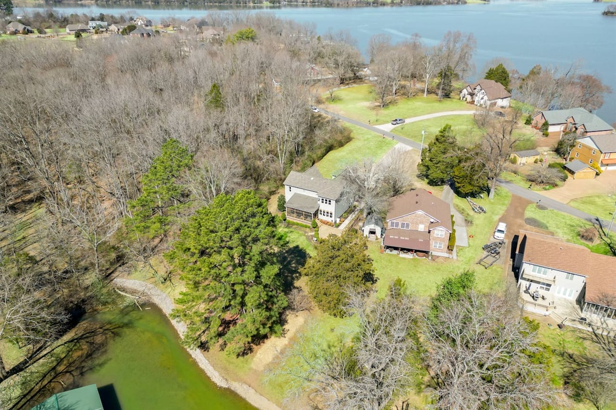 Property is on a Peninsula surrounded on three sides by the lake and cove water