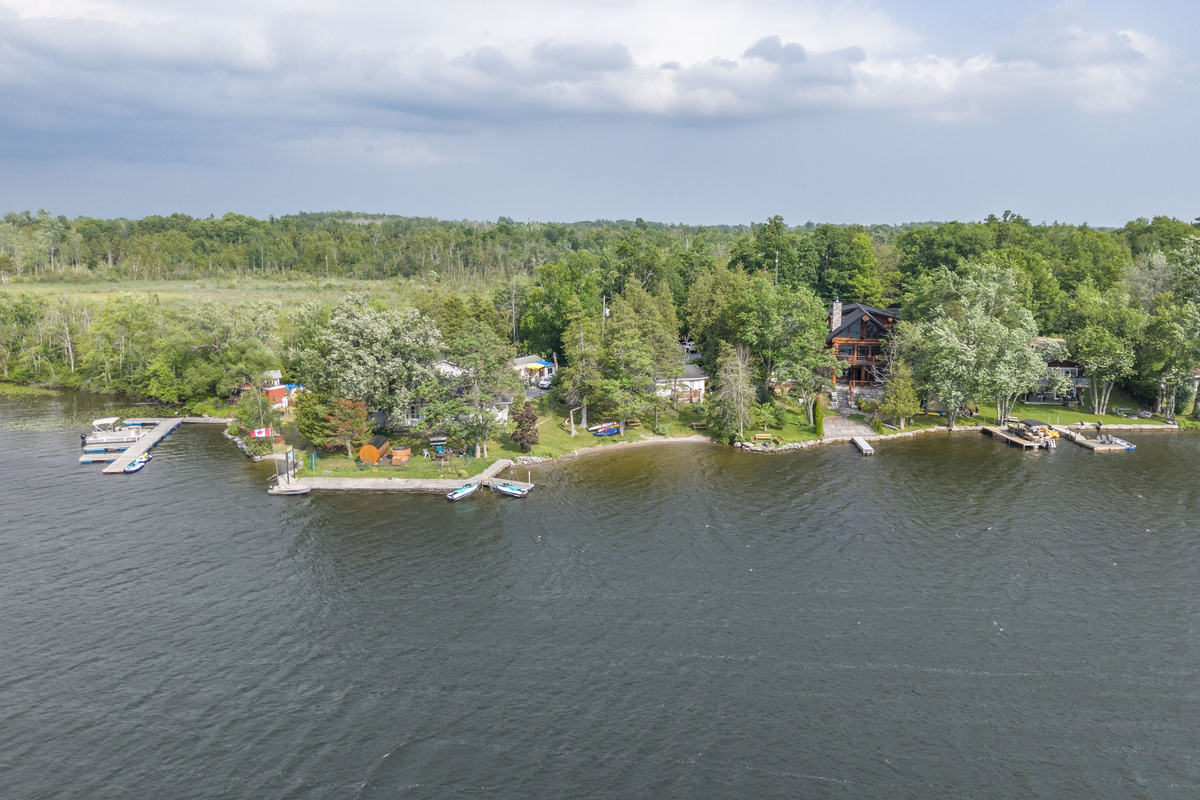 Aerial view of the cottages, shoreline and surrounding landscape