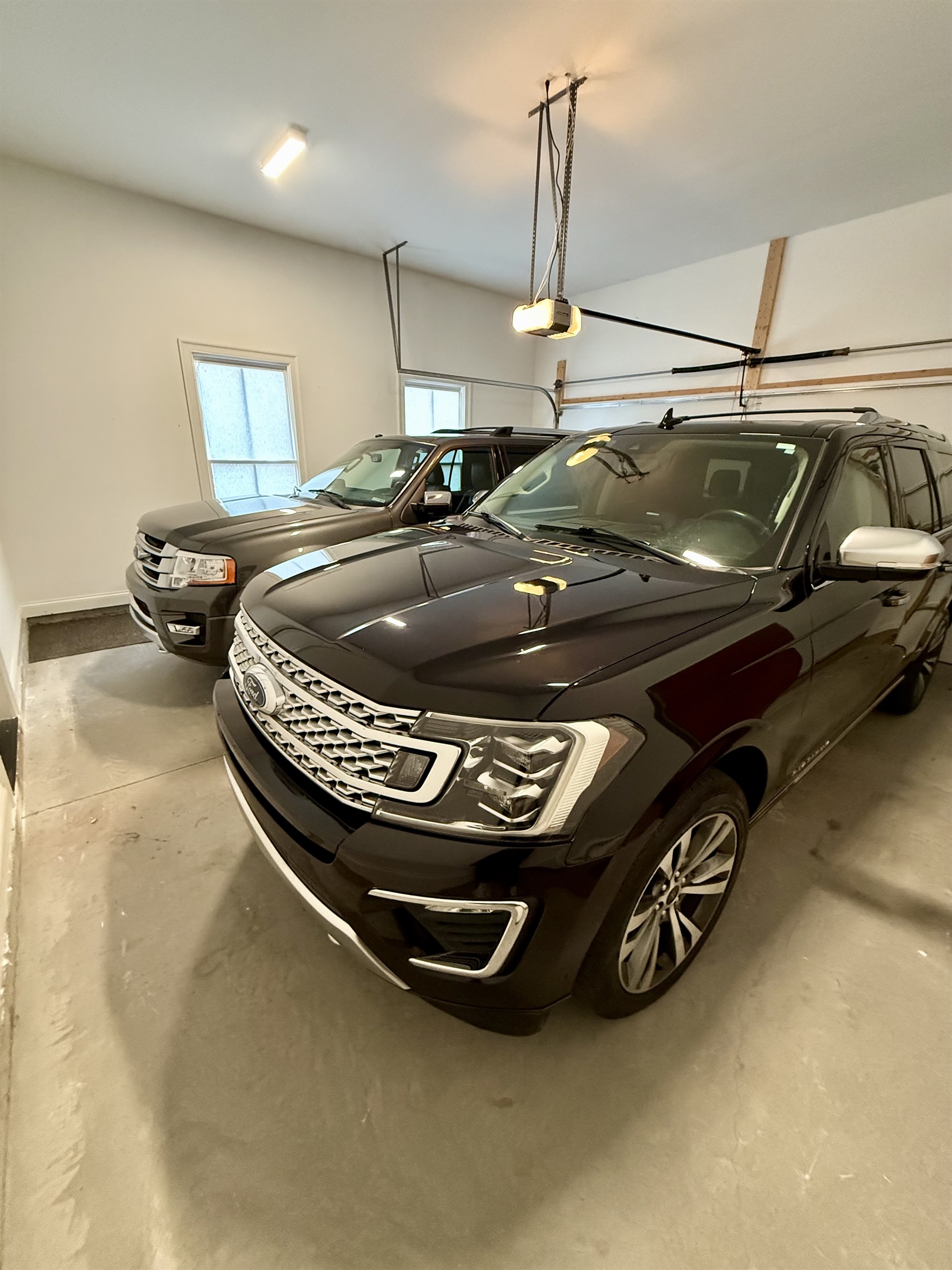 Secure garage for two full size SUVs. Modern and clean.
