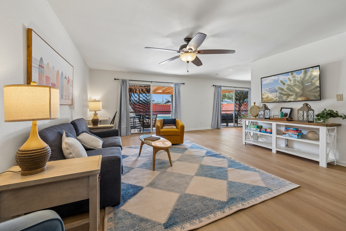 Relax and soak up the fun you had today in this spacious and comfortable living room complete with a 55" Smart TV.