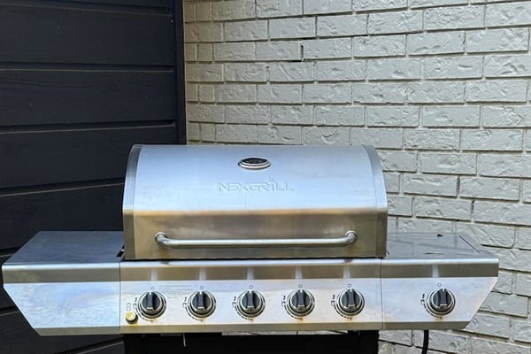 Propane grill provided with propane included, ideal for easy outdoor cooking, grilling dinners, and hosting relaxed meals.