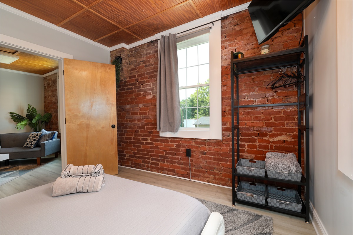 Bedroom with queen bed and Roku TV