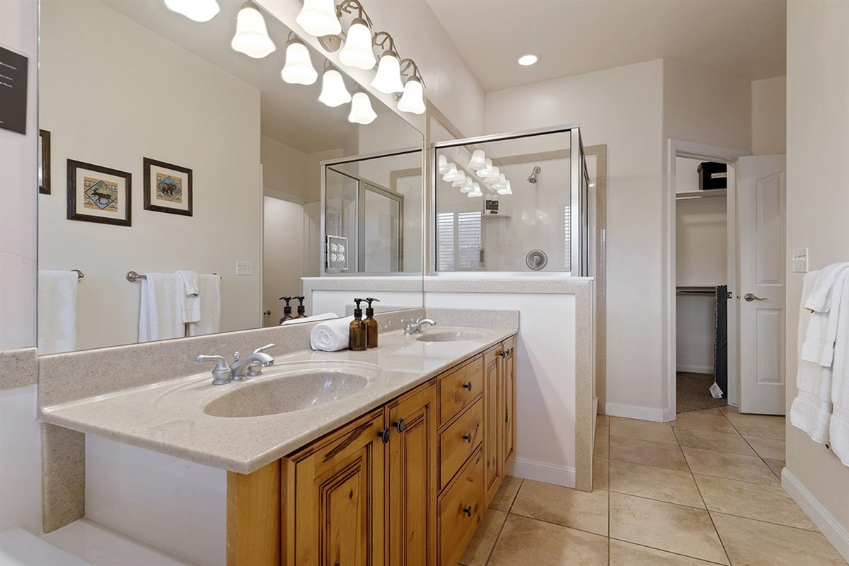 Spa-like ensuite with dual vanities and plenty of room to get ready.