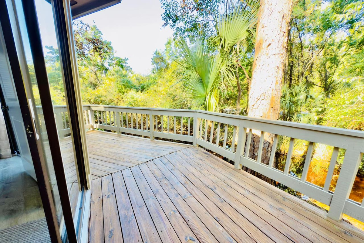 Wraparound deck among the trees