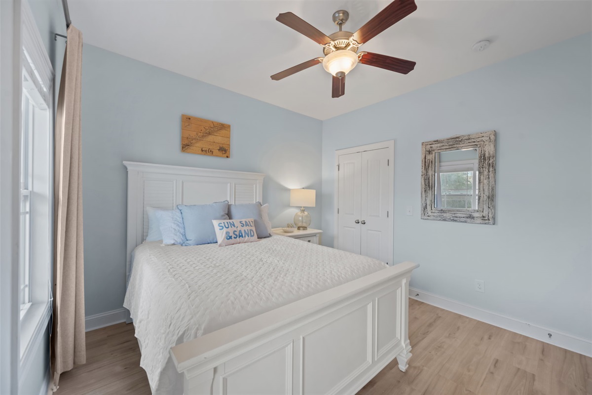 3rd Bedroom- relax like you're at home with a comfortable mattress, cozy linens, and room darkening curtains 