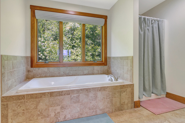 A modern jetted tub for relaxing after a long day