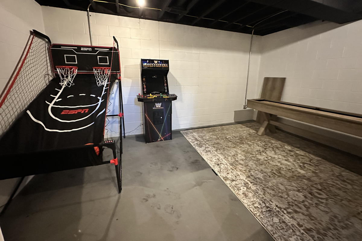 A game room made for family fun—basketball arcade, WWE arcade, shuffleboard and more give everyone something to play.