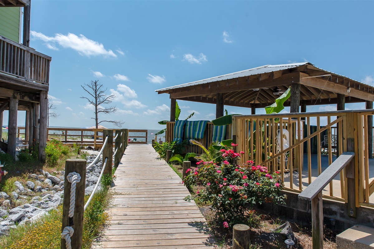 Private boardwalk to the beach & pool