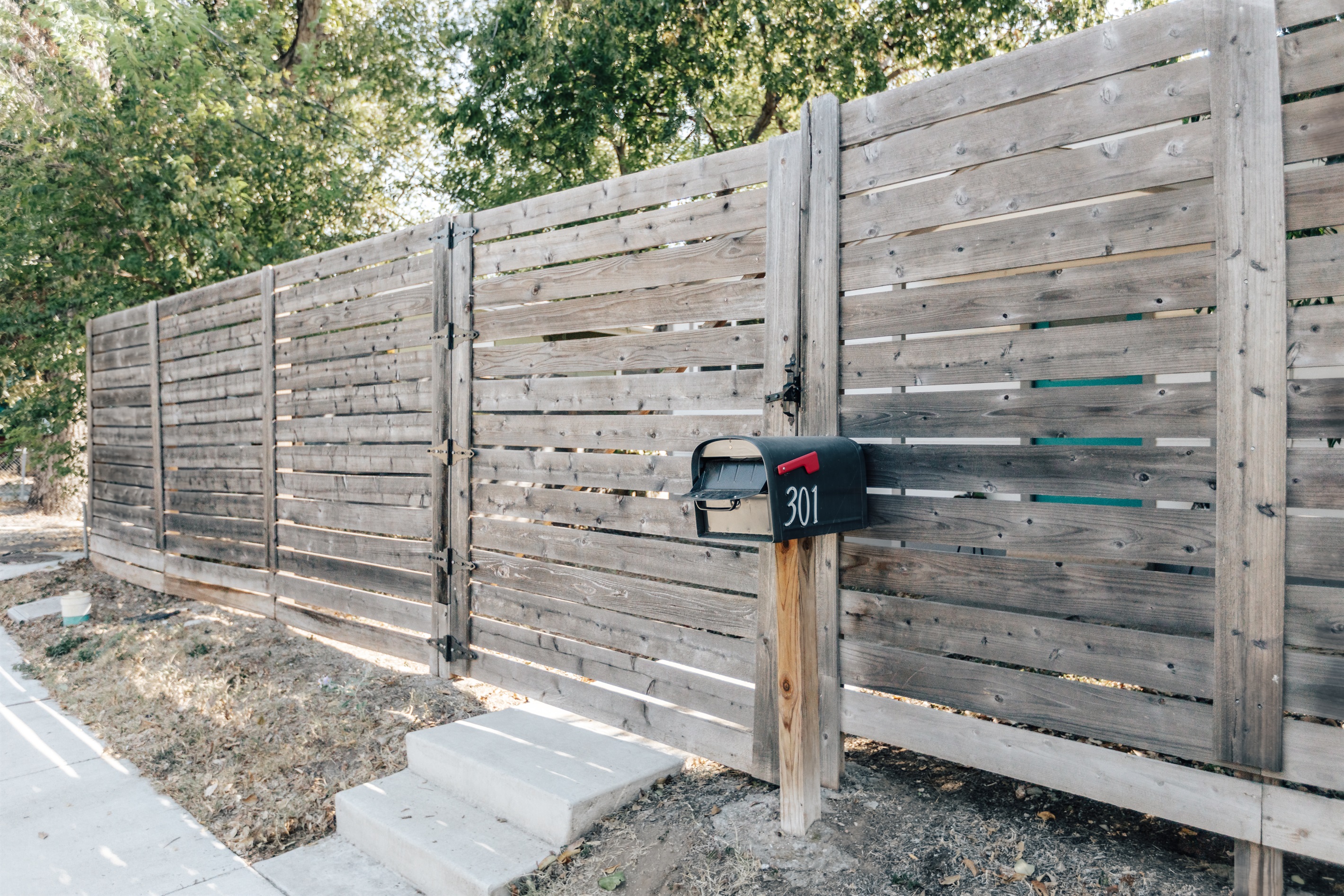 house has big fenced yard , grill