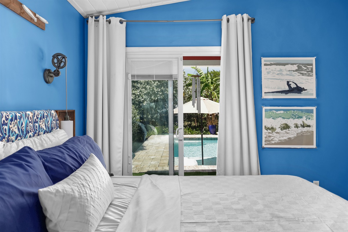 The primary bedroom has pool and garden views.