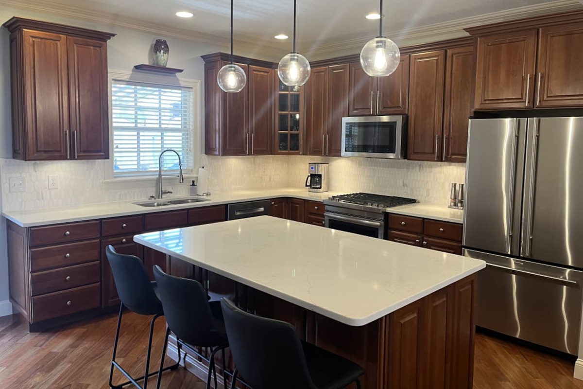 Well-appointed kitchen with a spacious countertop, providing plenty of room for meal prep, cooking, and entertaining.