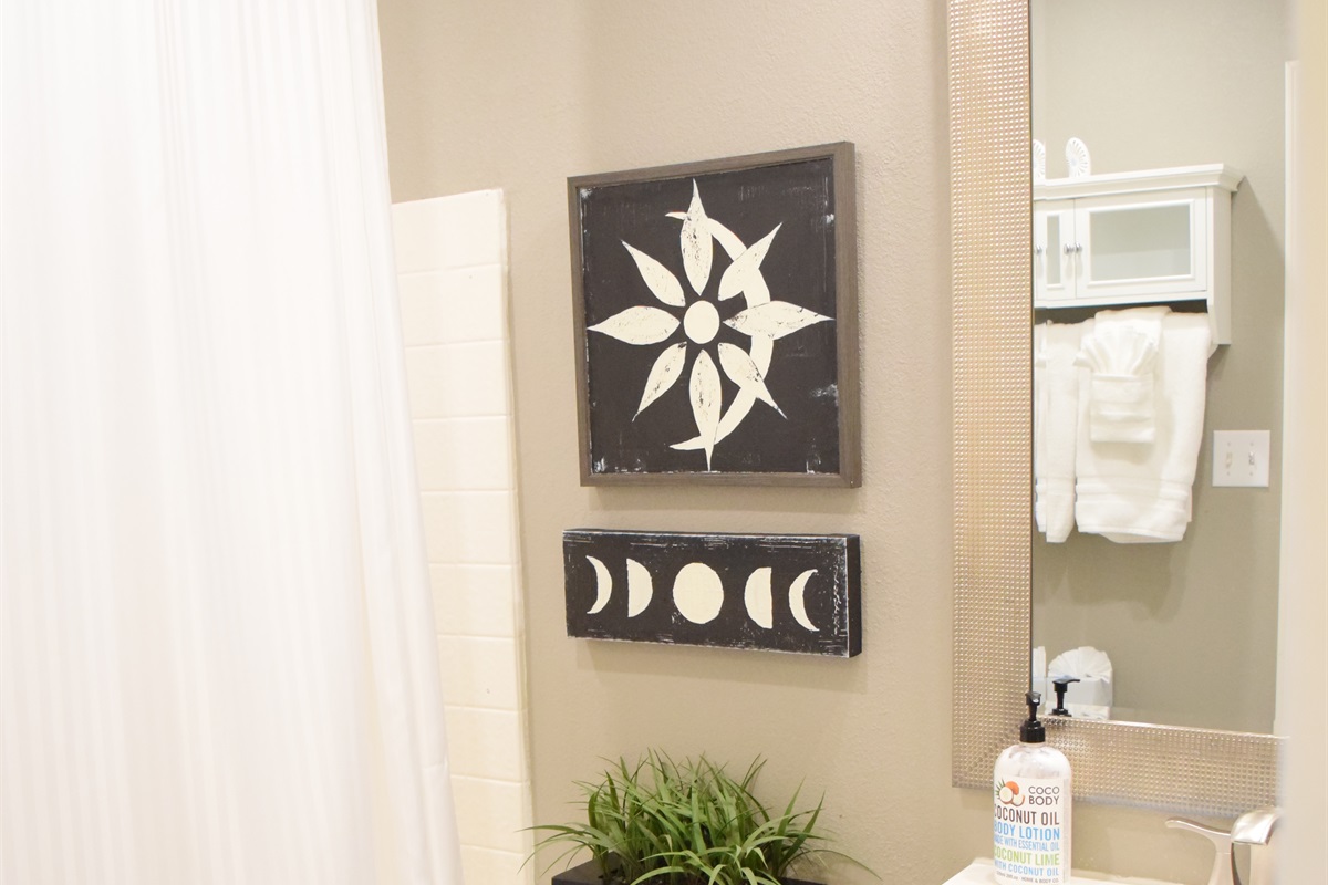 Shared restroom with shower/tub combo