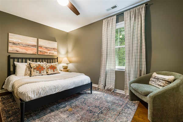 A welcoming queen bedroom offering comfort after a day of adventure.