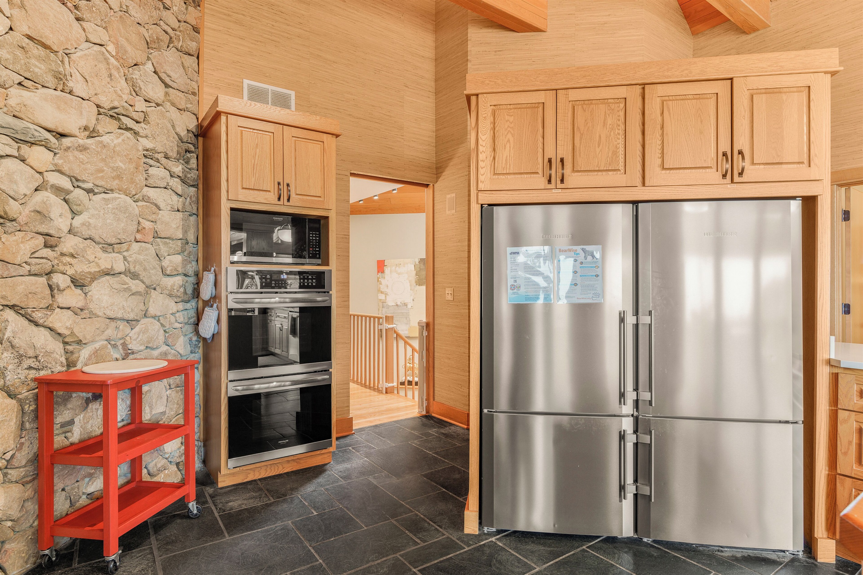 Two full size refrigerators (side by side), 2 ovens, microwave
