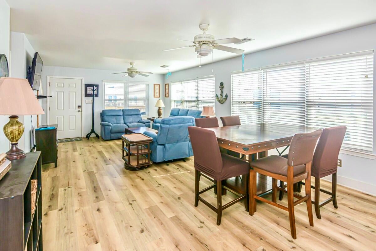 An open concept living room that flows right into the dining area and kitchen
