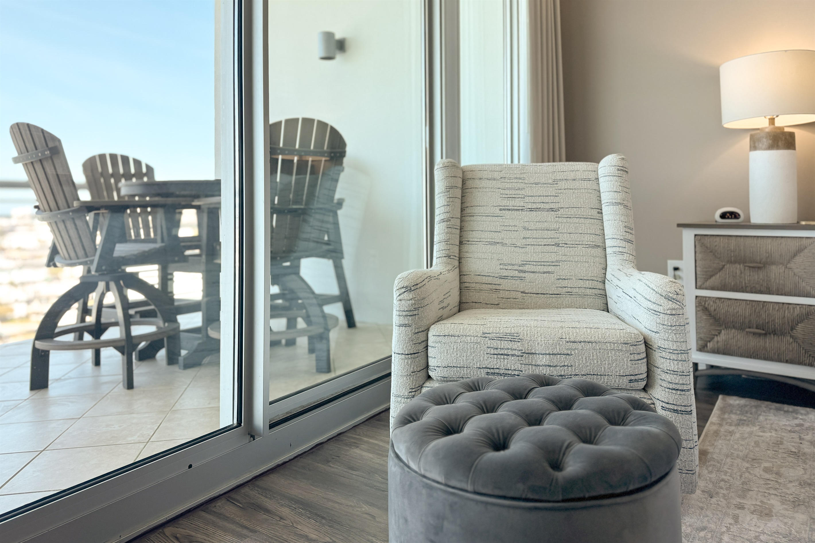 A light-filled living space with captivating views. This inviting room offers a perfect blend of comfort and style, creating a welcoming atmosphere for all.