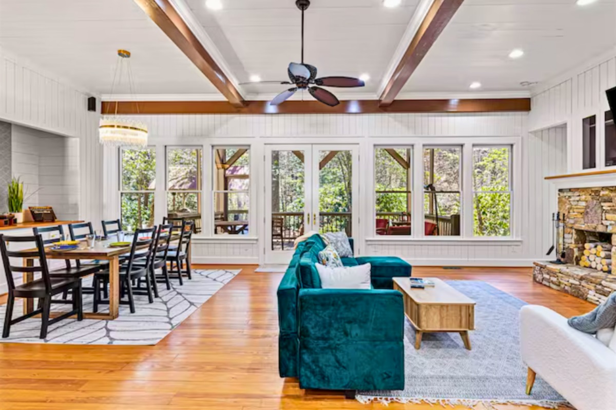 Tall Ceilings and Large Windows Bring in Tons of Natural Light While You Lounge on the Luxurious Couch by the Fire