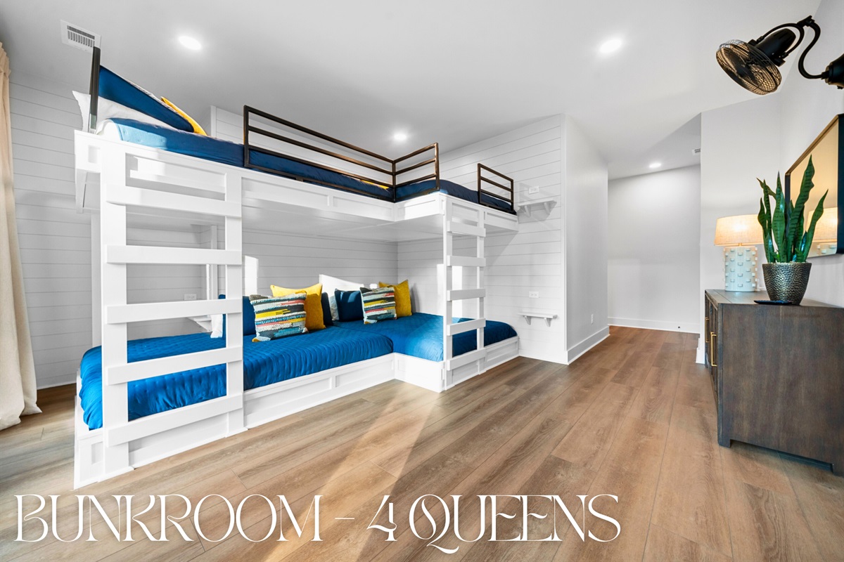 This bunk area with four queen beds is perfect for friends or family, providing a fun, spacious area for everyone to feel comfortable.