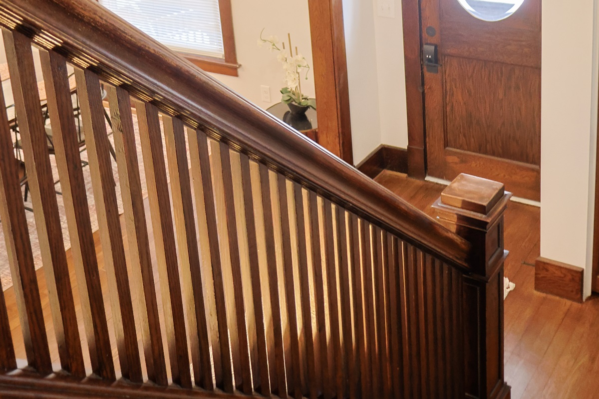 Gorgeous wooden staircase looking down to the entryway