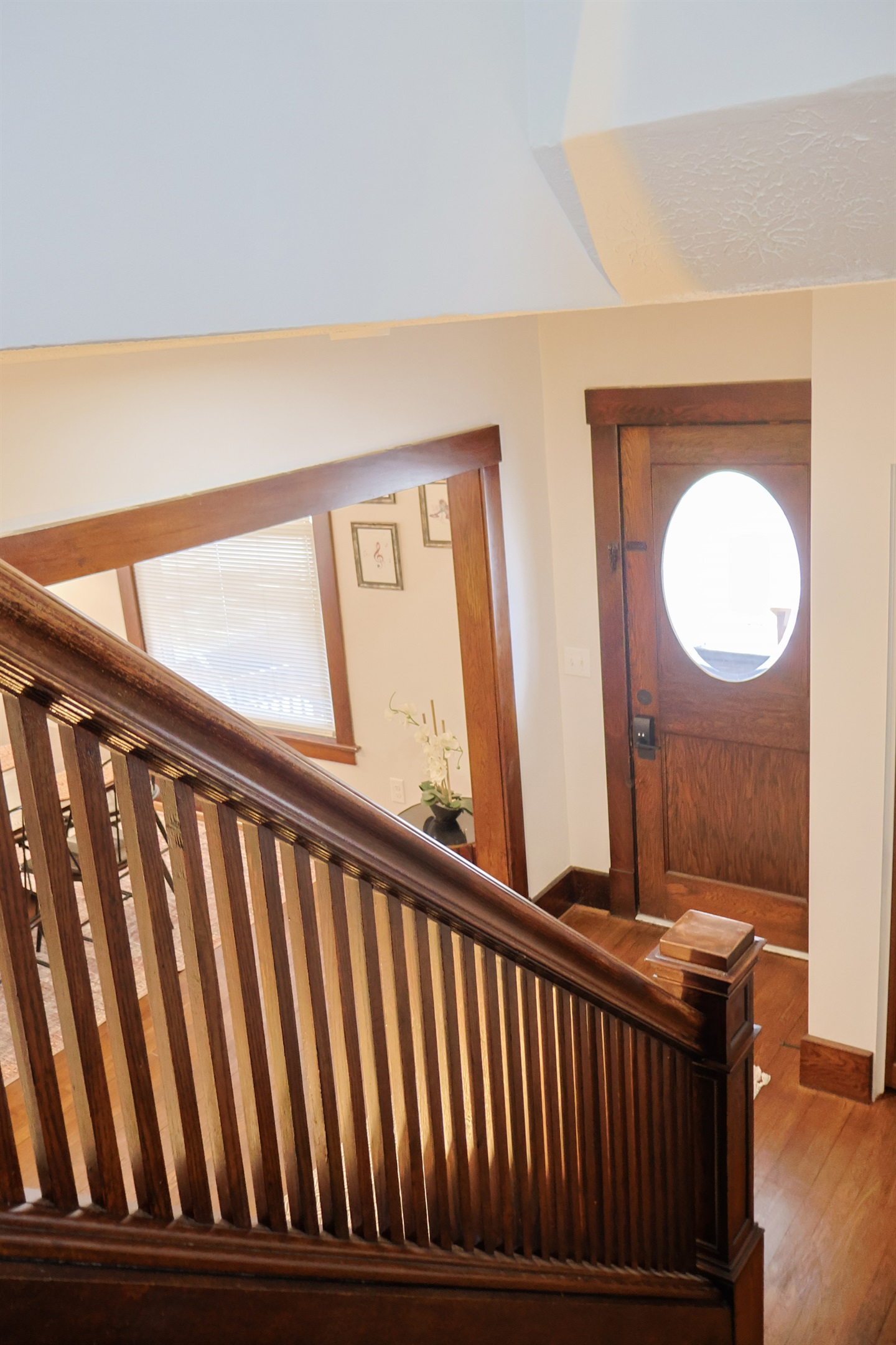 Gorgeous wooden staircase looking down to the entryway