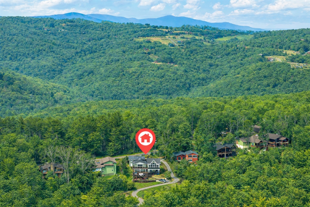 Perched on a ridge atop Beech Mountain, the home captures sweeping mountain views from the back of the property while remaining tucked into a peaceful, wooded setting on a beautiful street leading toward Banner Elk in one direction and Boone in the other.