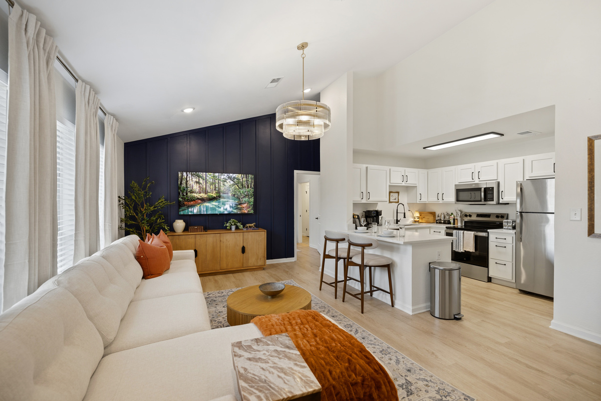 Keep the whole group together — the open plan means the cooks never miss the conversation or the game.