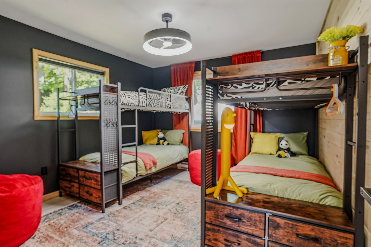 Kids & Teens Suite — two bunk beds with built-in storage, red accents, and room to play
