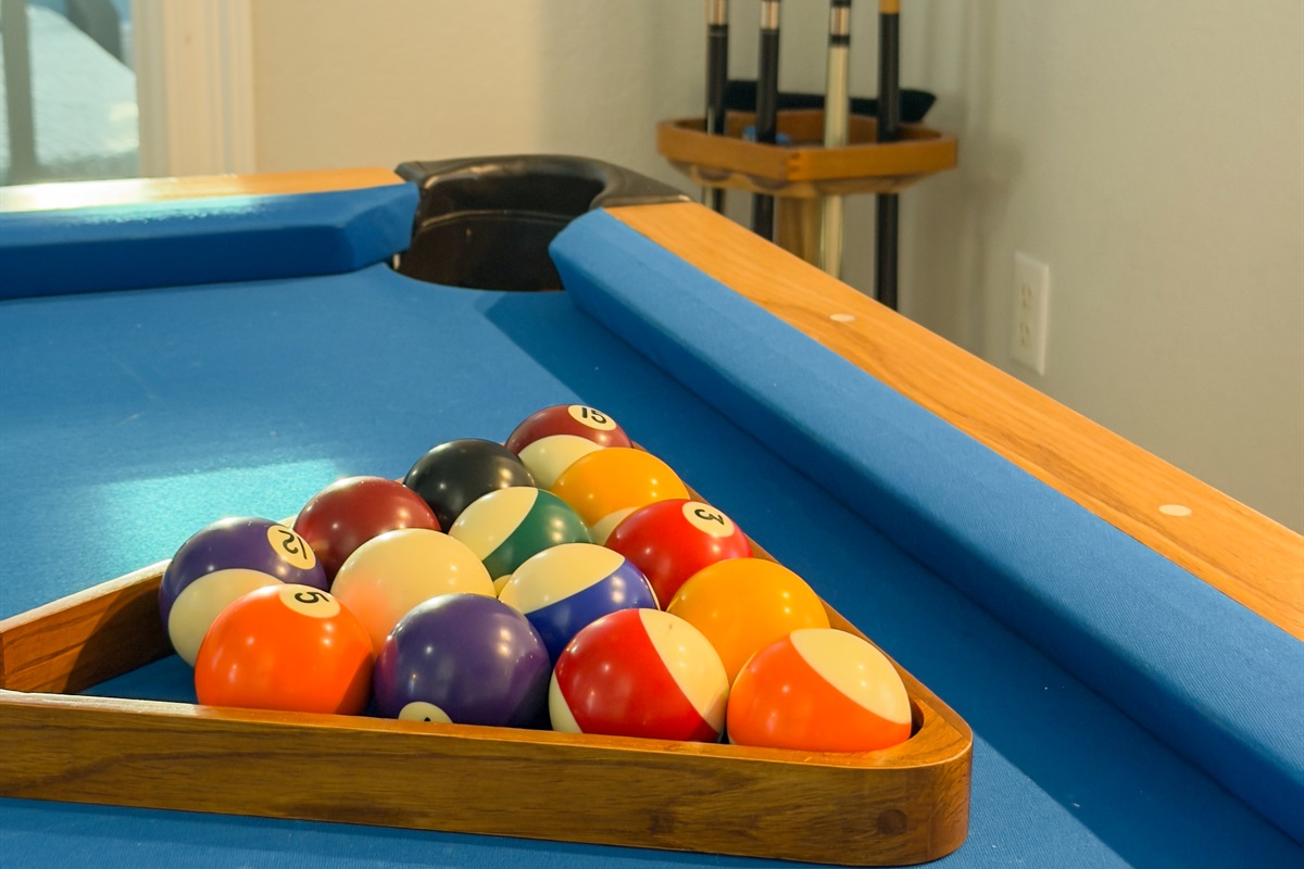 A full billiards setup creates the perfect spot to unwind, challenge friends, and keep the vacation fun going indoors.