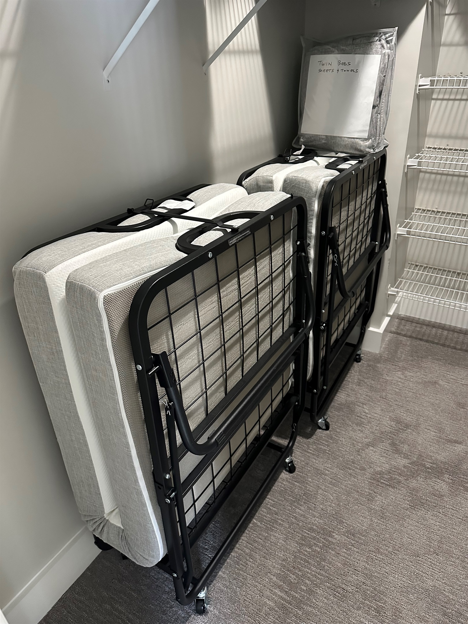 Twin beds stored in Master closet