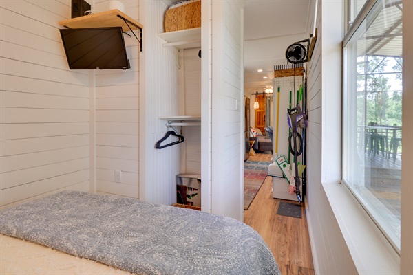 Closet and television in the bedroom just down the hall from kitchen in Container #1.