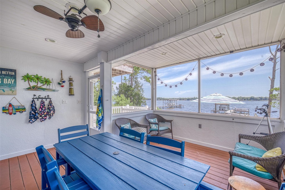 Screened in patio with views and dining