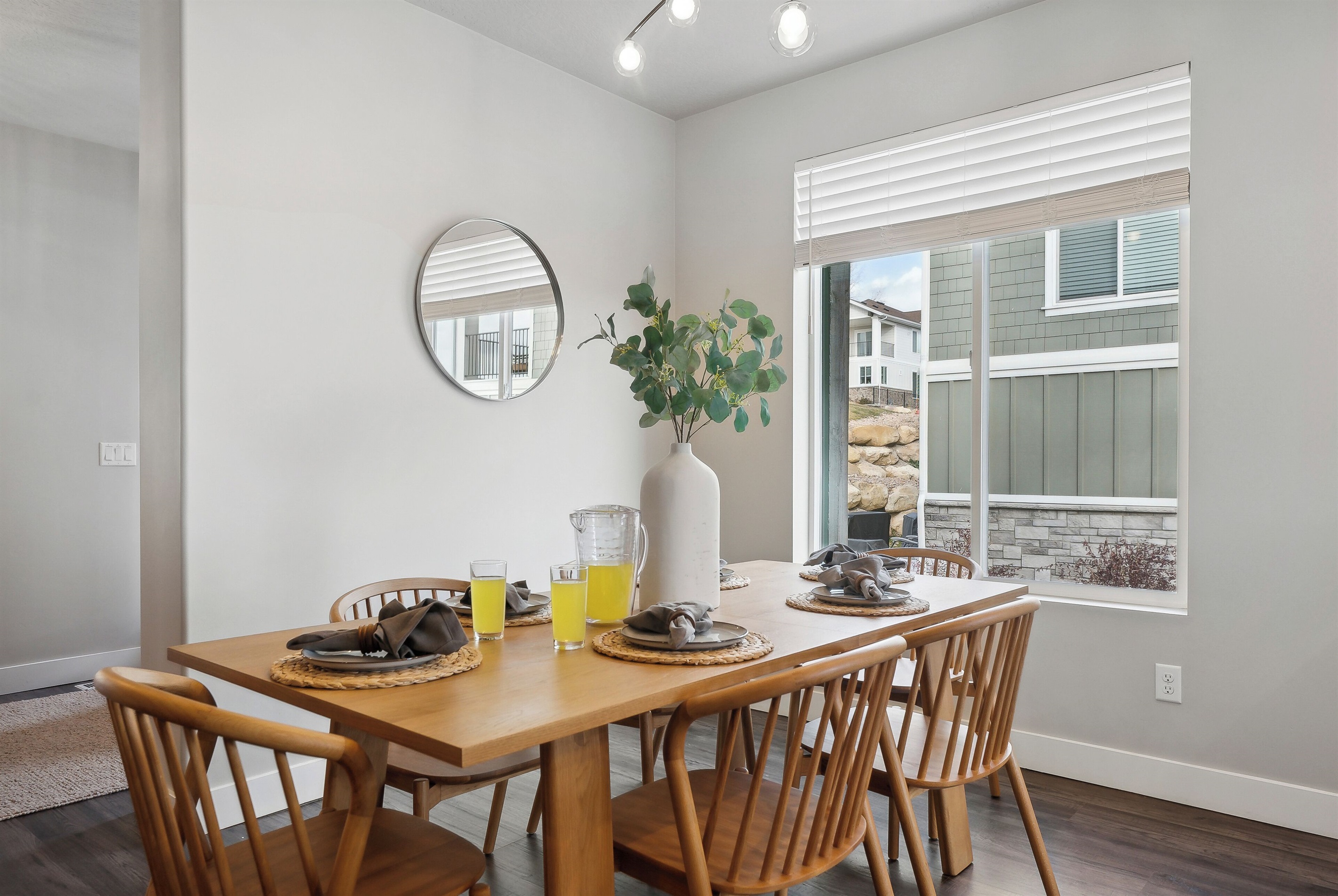 Space for everyone—dining table can be extended with leaf plus more seats at the kitchen island nearby.