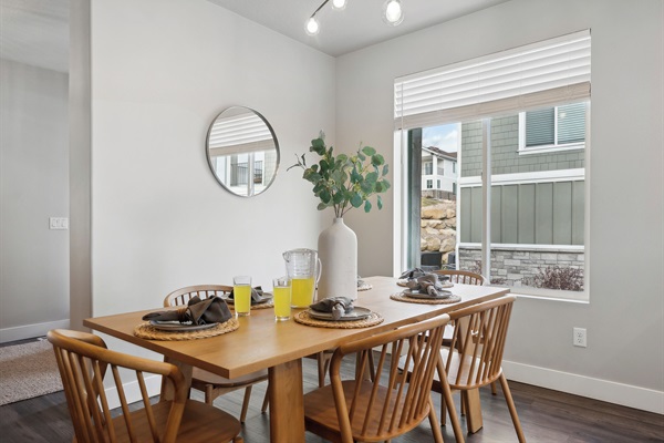 Space for everyone—dining table can be extended with leaf plus more seats at the kitchen island nearby.