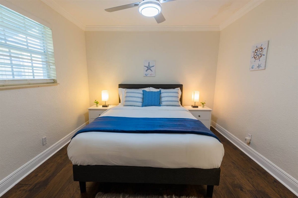 The 2nd Bedroom has 1 Queen bed, loads of closet space and coastal décor.