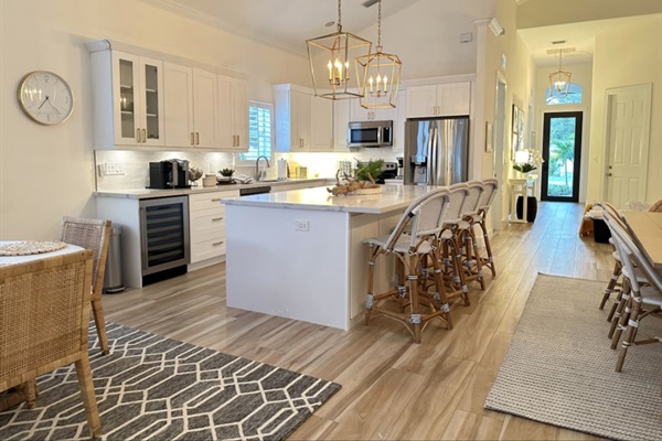 Fully Stocked Kitchen w/ Bar Seating and Two Tables!