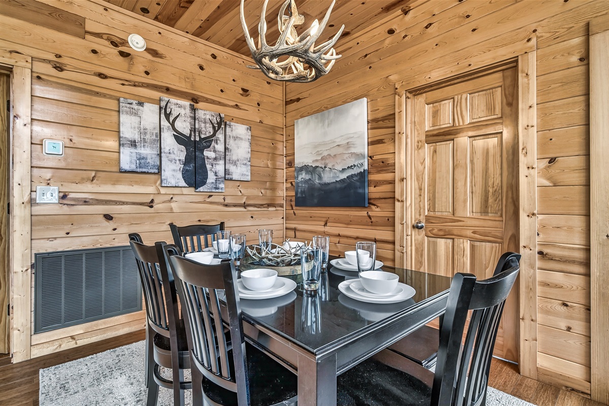 Dining room with table, chairs and a bench seat for all to gather round together