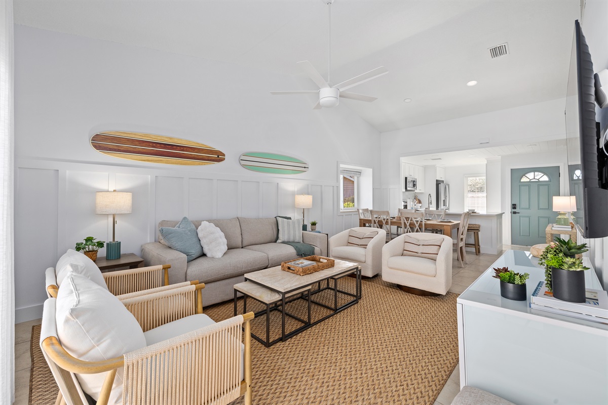 Light-filled living space with multiple seating areas designed for gathering and relaxing together