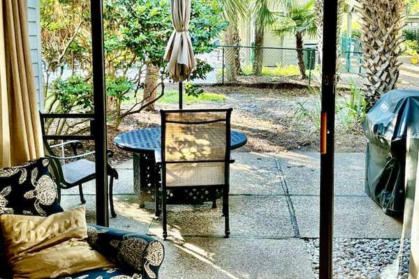 Patio doors with outdoor dining and grill