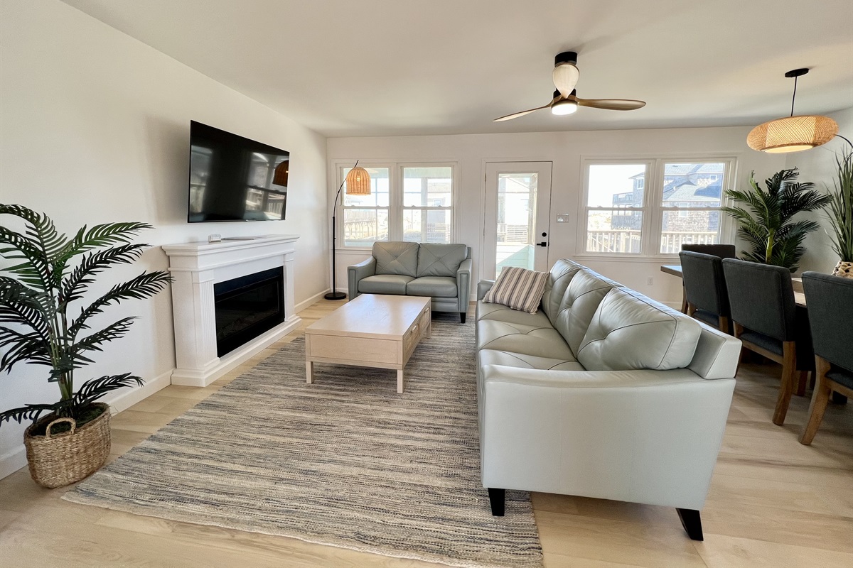 Get cozy with a good book by the fireplace and savor your favorite shows on the comfortable leather couches.