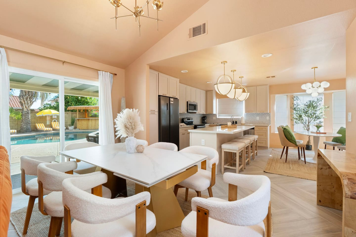Sit down for dinner under the chandelier here with seating for 8.