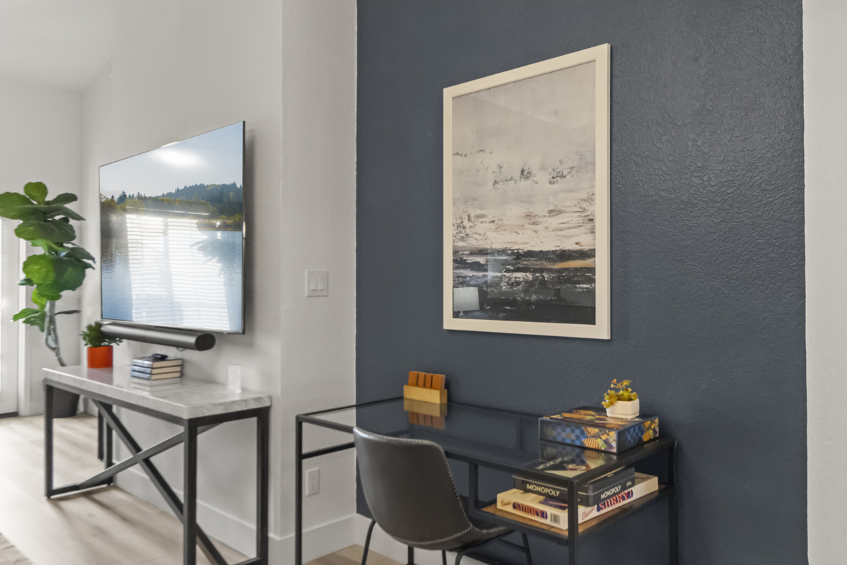 Convenient living area with a dedicated desk and chair, making it easy to work remotely while enjoying the comfort of the home.
