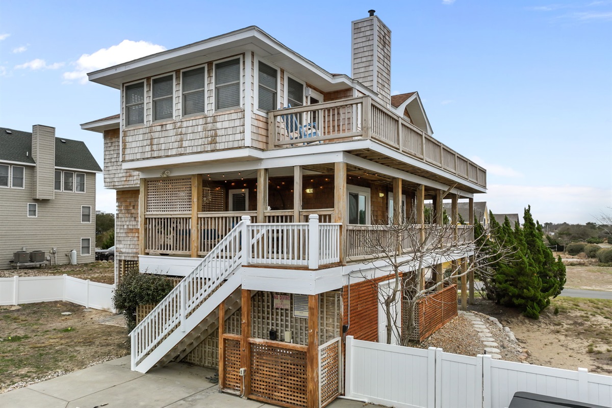 Welcome to Bay Watching—three levels of decks and classic coastal style.