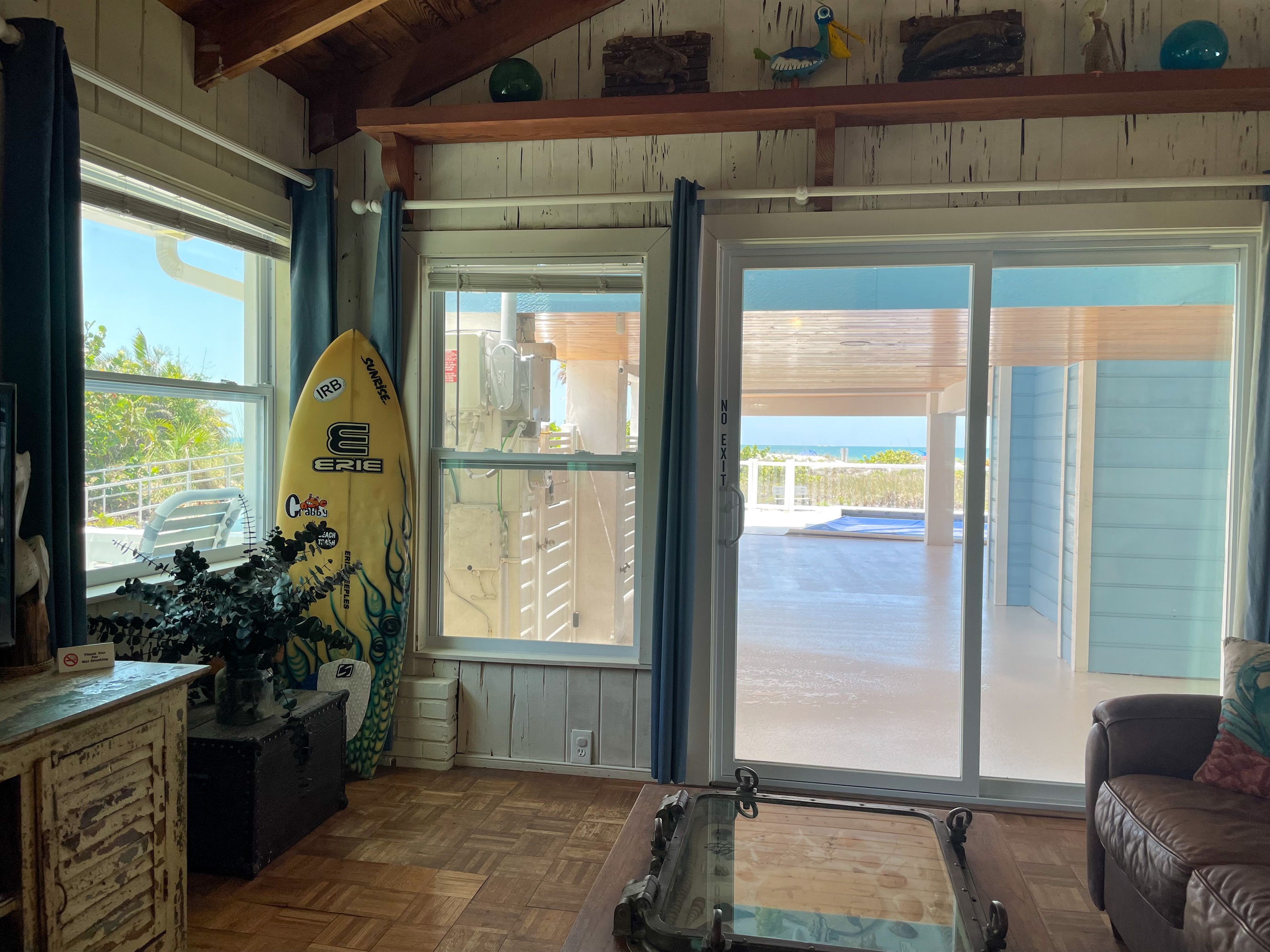 Views of beach and water from each window in the living room.
