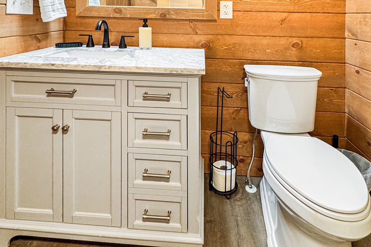 Bathroom Bliss: Enjoy a stylish retreat with modern fixtures and natural wood accents!
