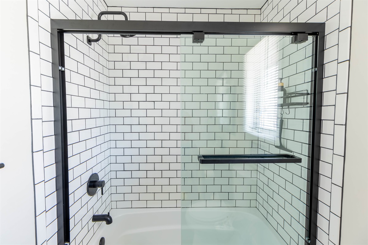 The upstairs bathroom has a tub/shower. Whether you're in the mood for a long soak or a quick rinse, this space provides the perfect retreat