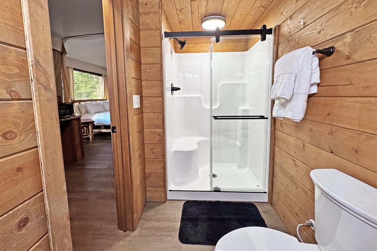 Enjoy a bright, modern bathroom with nature-inspired wood accents!