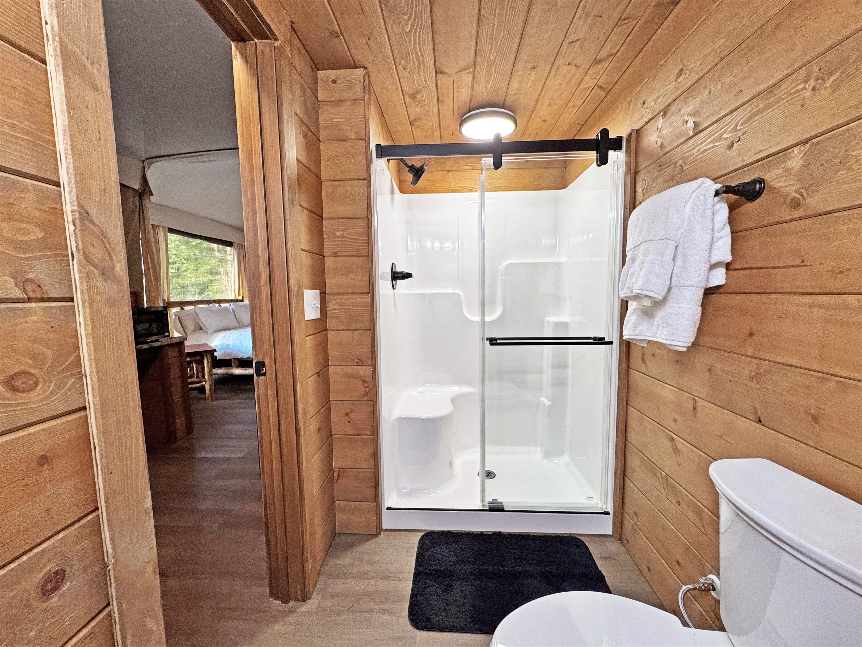 Enjoy a bright, modern bathroom with nature-inspired wood accents!