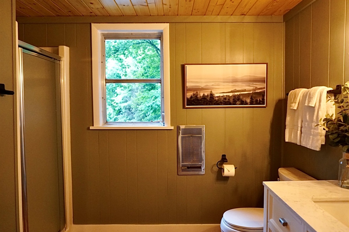 Refresh in this bright space featuring serene wooded views and modern decor!